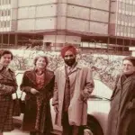 Hardev Singh Virk standing with his research group in front of a car at Marie Curie University, Paris (1977)